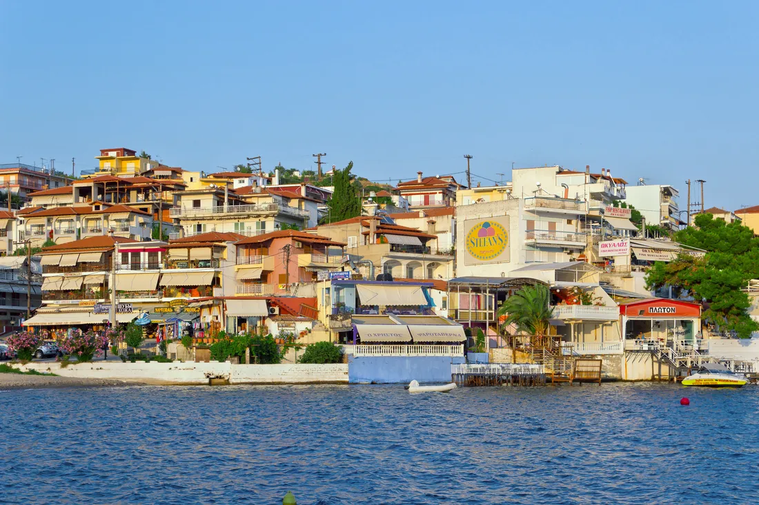 The densely built bay of Neos Marmaras, houses terraced above the water